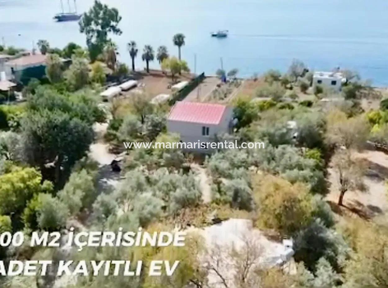 Detached House For Sale On 2000M2 Plot Of Land By The Sea In Marmaris Söğüt Neighborhood. Suitable For Tying A Boat In Front Of It.