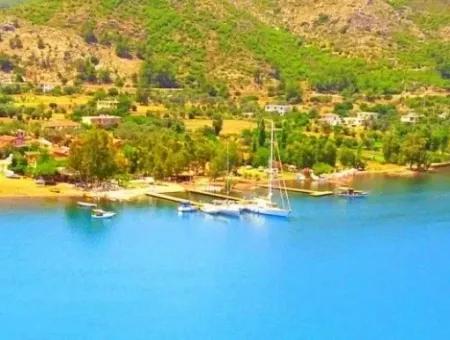 Marmaris Orhaniye Köyünde Denize Sıfır 3500M2 Turizm Yatırımı İçin Uygun Arsamız Satılıktır.